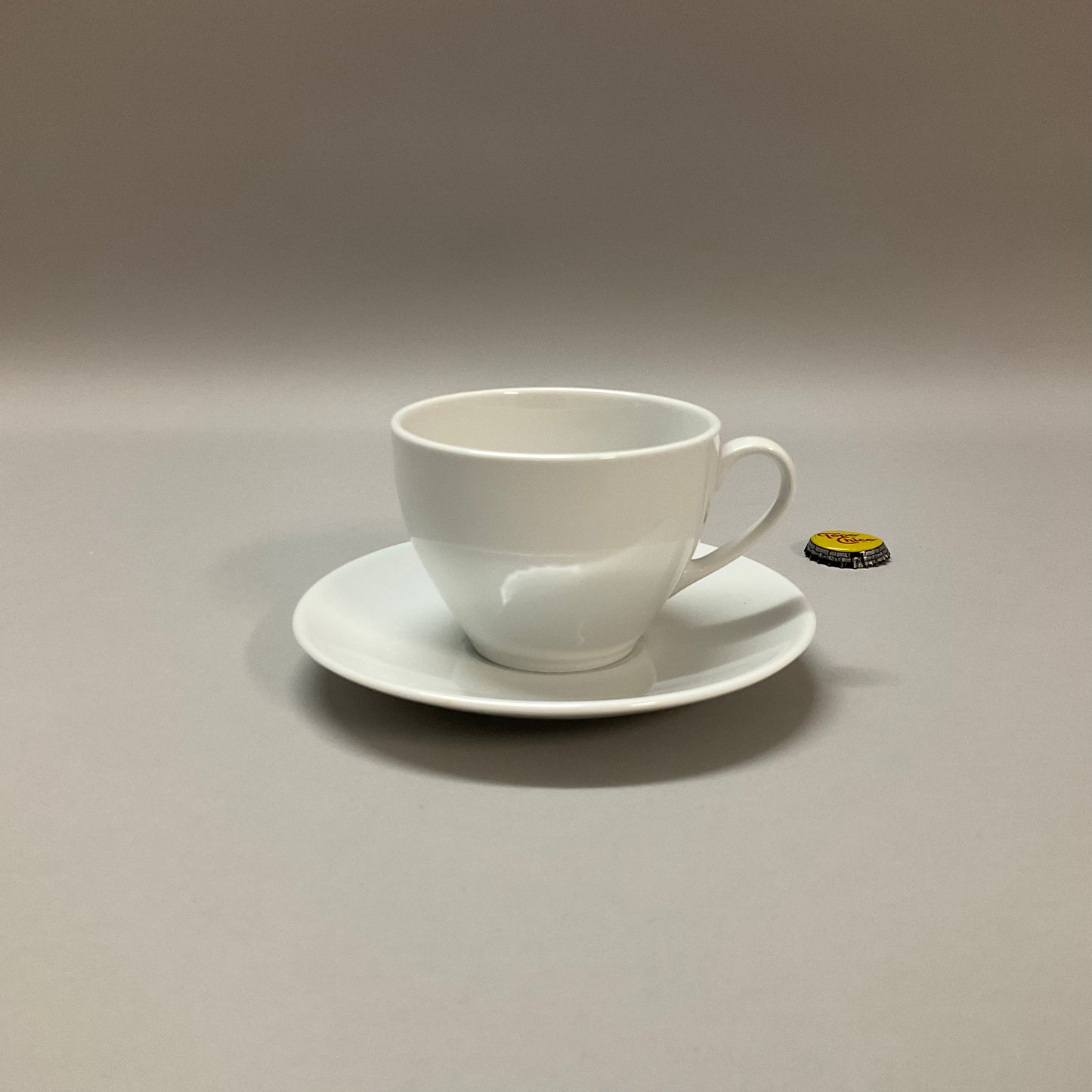 White Ceramic Tapered Cup and Saucer