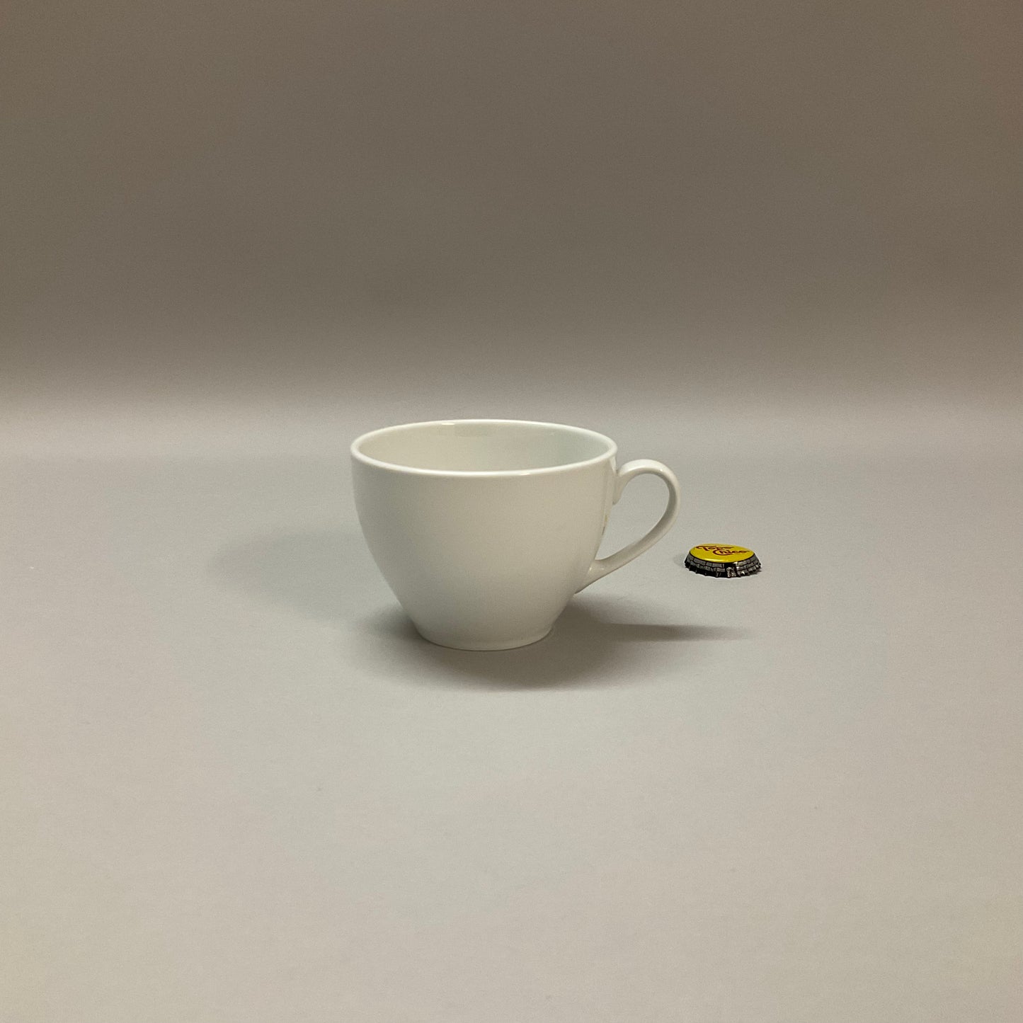 White Ceramic Tapered Cup and Saucer